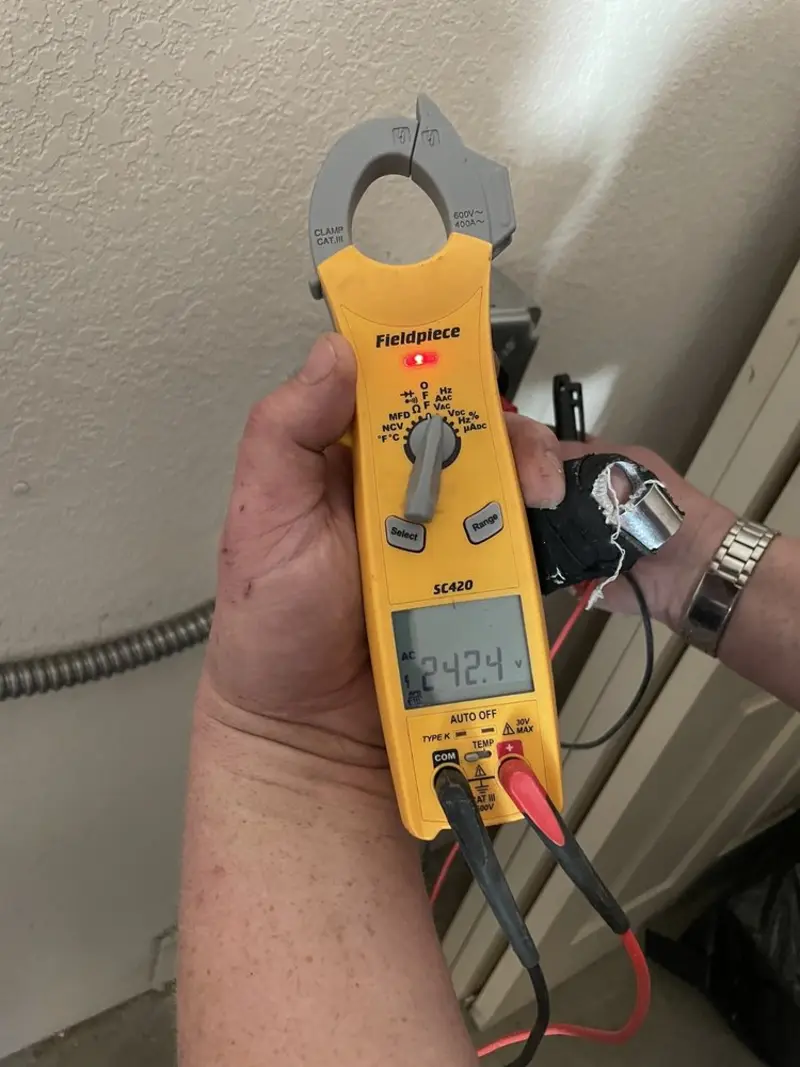 Voltage testing with clamp meter during Ceiling Fan Installation in Callaway
